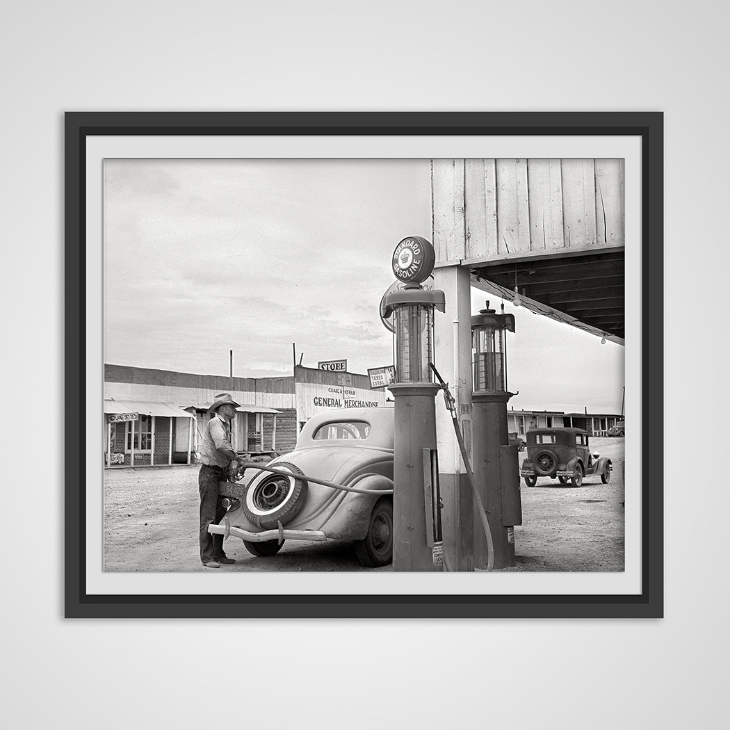 Man Filling Car at the Gas Pump in Pie Town, New Mexico